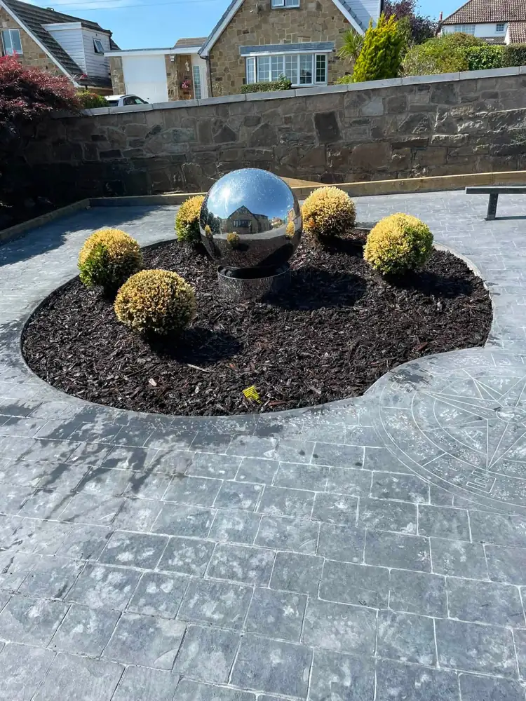 After: planted feature circle with topiary